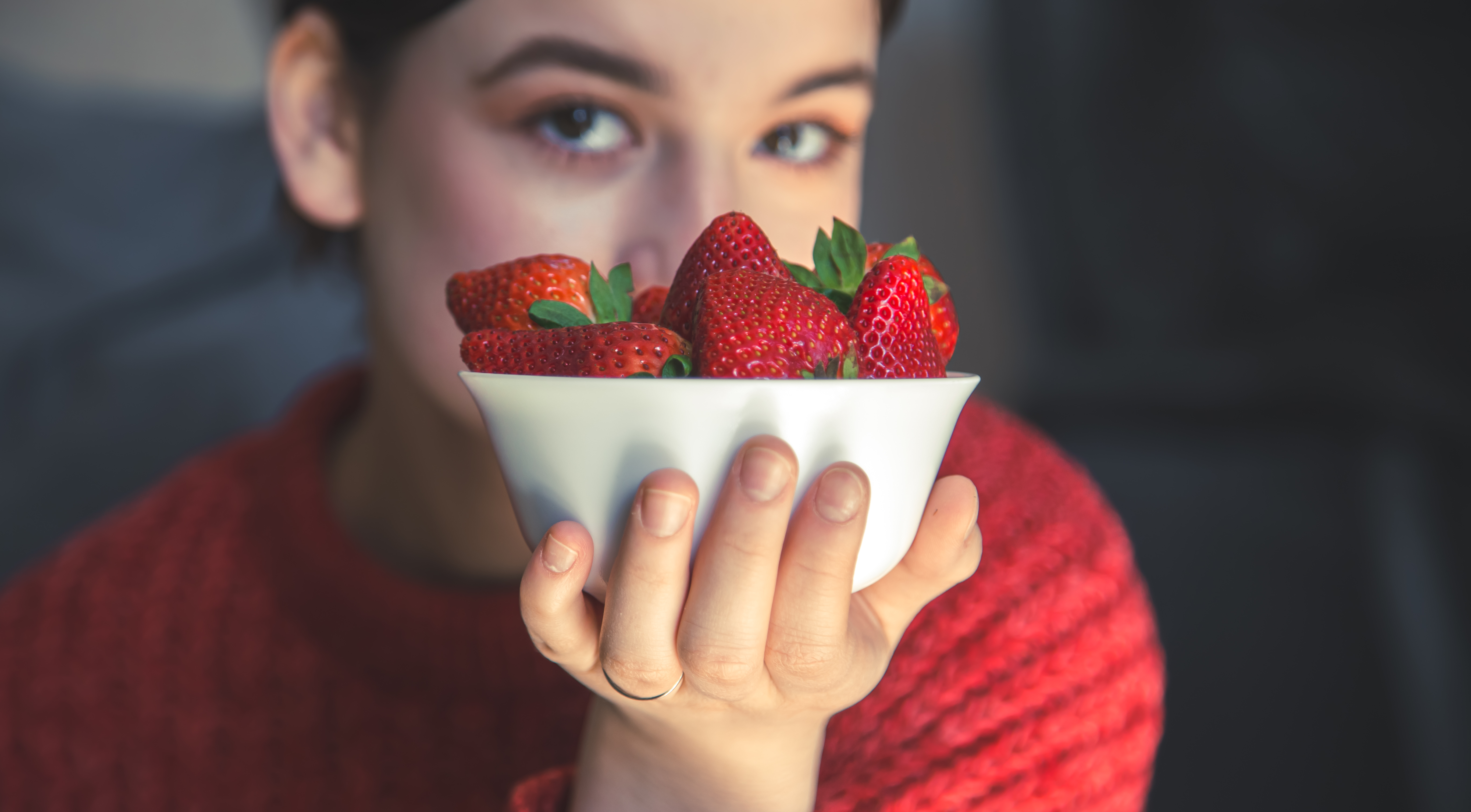 young-woman-holds-bowl-strawberries-her-hands
